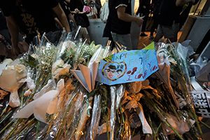 A makeshift shrine for a protester who died in a fall, outside Pacific Place, Admiralty, the site of the accident, 16 June 2019