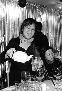 Choreographer Mui Cheuk-Yin pouring tea in the Yellow Door restaurant, Central, 23 December 2001