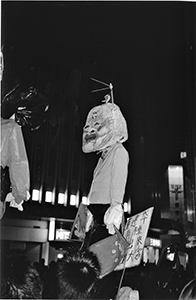 Effigy of Hong Kong Chief Executive Tung Chee-hwa being carried on a pro-democracy march from Causeway Bay to Central, 1 July 2003