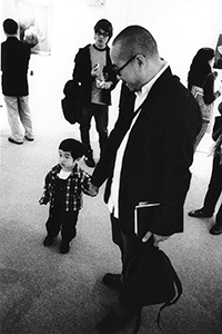 Sculptor Ho Siu-Kee and his son, at the opening of his exhibition at Grotto Fine Arts, Wyndham Street, Hong Kong Island, 9 December 2003
