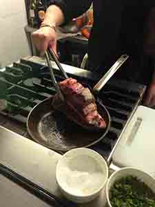 Chef cooking a Florentine steak, Hollywood Road, Sheung Wan, Hong Kong Island, 28 October 2013