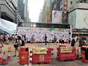Bus barricade with posters at the Mongkok Umbrella Movement occupation site, 30 September 2014