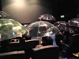 Audience holding up umbrellas as a political gesture after a film showing at Broadway Cinema, Metroplaza, Kwai Chung, 12 November 2014