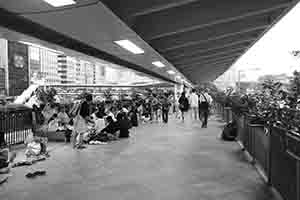 Domestic helpers gathering on their day off on an elevated walkway, Central, 30 October 2016
