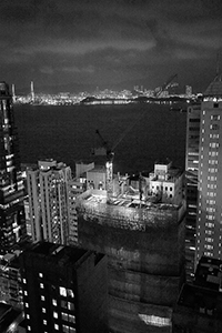 Night view of Victoria Harbour and a construction site at 33 Des Voeux Road West, Sheung Wan, 3 October 2016