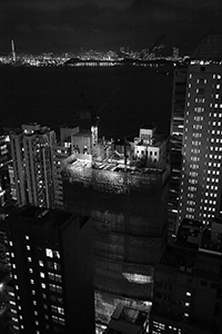 Night view of Victoria Harbour and a construction site at 33 Des Voeux Road West, Sheung Wan, 3 October 2016