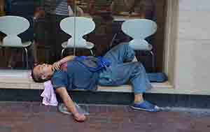 A man resting outside McDonald's, Sham Shui Po, 6 October 2016