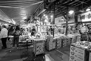 Shoppers and stalls in Yau Ma Tei Fruit Market, Kowloon, 27 November 2016