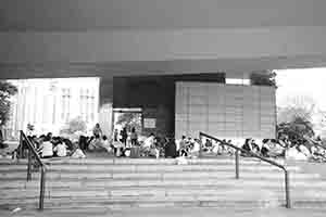 Domestic helpers on their day off gathering in a sheltered area next to the Bank of China Tower, 6 Nov 2016