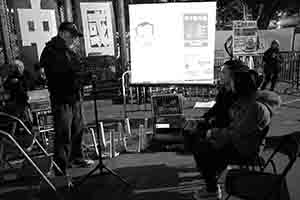 Cartoonist Zunzi drawing a digital caricature, at the Lunar New Year flower market, Victoria Park, 26 January 2017