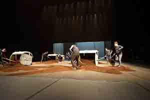 Workers preparing the stage in the Cultural Centre Grand Theatre for a performance by Tanztheater Wuppertal Pina Bausch of Rite of Spring, 8 March 2017