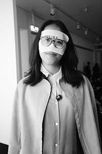 Curator Christina Li  at a musical performance at Spring Workshop, Wong Chuk Hang, where all were invited to wear masks, 11 March 2017
