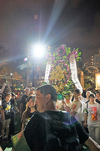 Rally participants carrying a wreath, at the annual memorial rally in remembrance of the events of 1989, Victoria Park, 4 June 2017