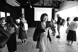 Artist Phoebe Man and other guests at the opening of David Clarke's '31 June 1997' exhibition, Videotage, Cattle Depot Artist Village, To Kwa Wan, Kowloon, 29 June 2017