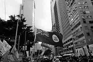 Colonial era Hong Kong flag, at the annual pro-democracy march from Victoria Park, Hennessy Road, Wanchai, 1 July 2017