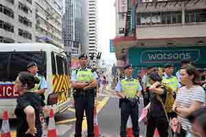 Police at the annual pro-democracy march from Victoria Park, Hennessy Road, Wanchai, 1 July 2017