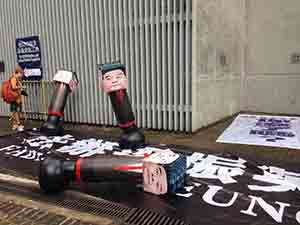 Photos of Leung Chun-ying placed on punching bags, annual pro-democracy march from Victoria Park, Admiralty, 1 July 2017