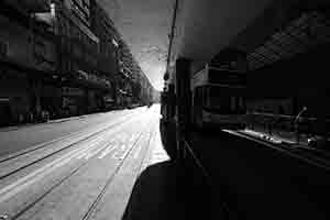 Light and shadow at a tram stop on Des Voeux Road West, Sheung Wan, 20 August 2017