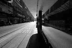 Light and shadow at a tram stop on Des Voeux Road West, Sheung Wan, 20 August 2017