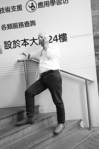 John Batten talking on his phone outside Sheung Wan Post Office, Hong Kong Island, 29 September 2017