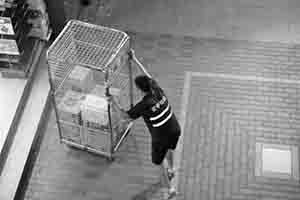 Worker transporting goods, off New Market Street, Sheung Wan, 18 November 2017