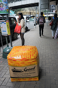 Foreign domestic helpers packing goods on the street for sending to their home country, Pedder Street, 25 November 2017