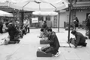 Praying at the temple, Wong Tai SIn, Kowloon, 30 January 2018