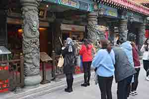 People wishing for luck at Wong Tai Sin temple, Kowloon, 30 January 2018