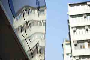 Reflection of buildings on a shop sign, Sham Shui Po, 16 February 2018