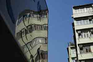 Reflection of buildings on a shop sign, Sham Shui Po, 16 February 2018