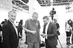 Wolfgang Tillmans (middle) and Jeff Koons (right) at Art Basel Hong Kong, Convention and Exhibition Centre,  Wanchai, 27 March 2018