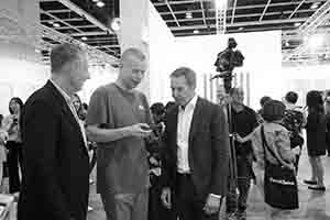 Wolfgang Tillmans (middle) and Jeff Koons (right) at Art Basel Hong Kong, Convention and Exhibition Centre,  Wanchai, 27 March 2018