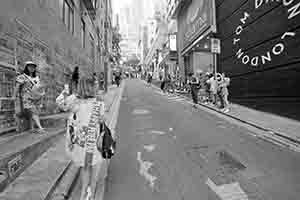 Taking photos in front of street art, Graham Street, Central, 30 April 2018