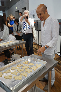 Warren Leung, with cookies from 'The spectacle of space consumption',  Tai Kwun, Central, 8 June 2018