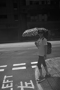 Using an umbrella against the sun, Sheung Wan, 30 June 2018