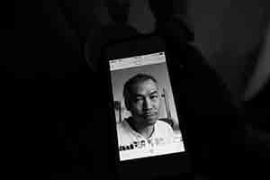Portrait of Warren Leung on a phone, altered to look older and more hairy, Goethe-Institut, Harbour Road, Wanchai, 1 June 2018