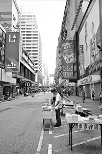 Buddhist literature being distributed, Sai Yeung Choi Street South, Mongkok, 24 June 2018