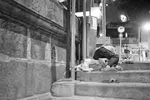 Homeless man asleep on Ladder Street, near Man Mo Temple, Sheung Wan, 27 June 2018