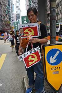Participant in the annual pro-democracy march, Hennessy Road, Wanchai, 1 July 2018