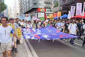 Participants in the annual pro-democracy march, Hennessy Road, Wanchai, 1 July 2018