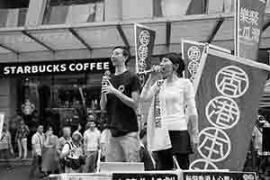 Claudia Mo addressing participants in the annual pro-democracy march, Hennessy Road, Wanchai, 1 July 2018