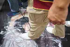 Stepping on a portrait of Carrie Lam during the annual pro-democracy march, Hennessy Road, Wanchai, 1 July 2018