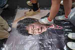 Stepping on a portrait of Carrie Lam during the annual pro-democracy march, Hennessy Road, Wanchai, 1 July 2018