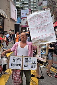 Participant in the annual pro-democracy march, Causeway Bay, 1 July 2018