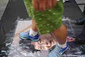 Stepping on a portrait of Carrie Lam during the annual pro-democracy march, Hennessy Road, Wanchai, 1 July 2018