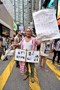 Participant in the annual pro-democracy march, Causeway Bay, 1 July 2018