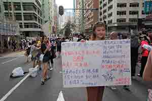 Participant in the annual pro-democracy march, Hennessy Road, Wanchai,  1 July 2018