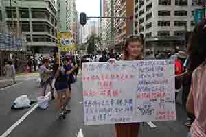 Participant in the annual pro-democracy march, Hennessy Road, Wanchai, 1 July 2018