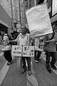 Participant in the annual pro-democracy march, Causeway Bay, 1 July 2018