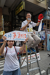 Fernando Cheung addressing participants in the annual pro-democracy march, Hennessy Road, Wanchai, 1 July 2018